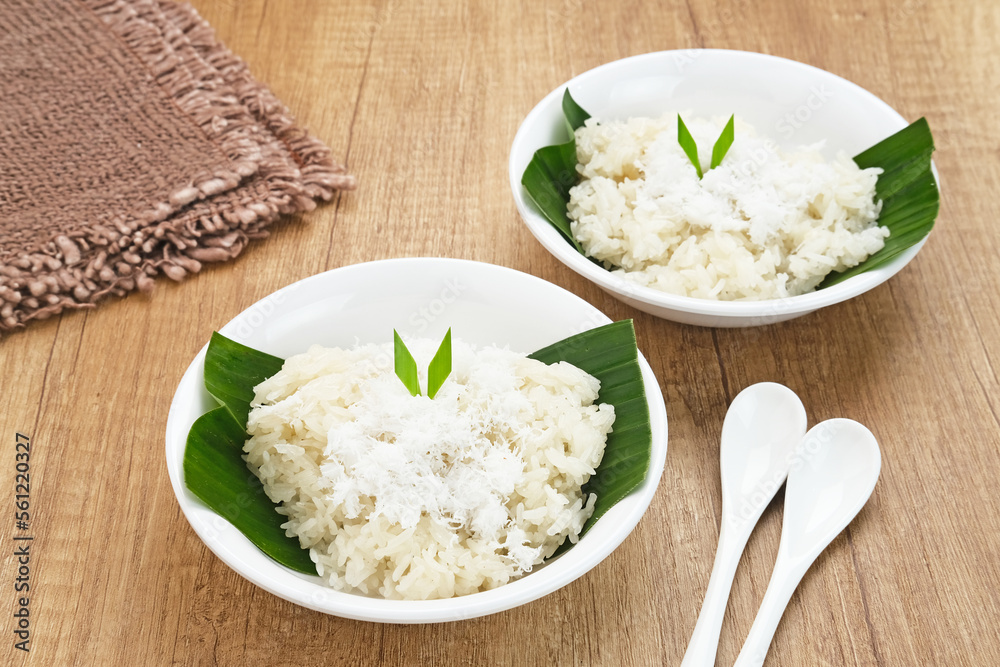 Ketan Kelapa Parut, Indonesian traditional snack, made from steamed glutinous rice and served with grated coconut
Ketan Kelapa Parut, Indonesian traditional snack, made from steamed glutinous rice and served with grated coconut