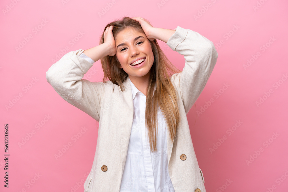 Young caucasian woman isolated on pink bakcground laughing