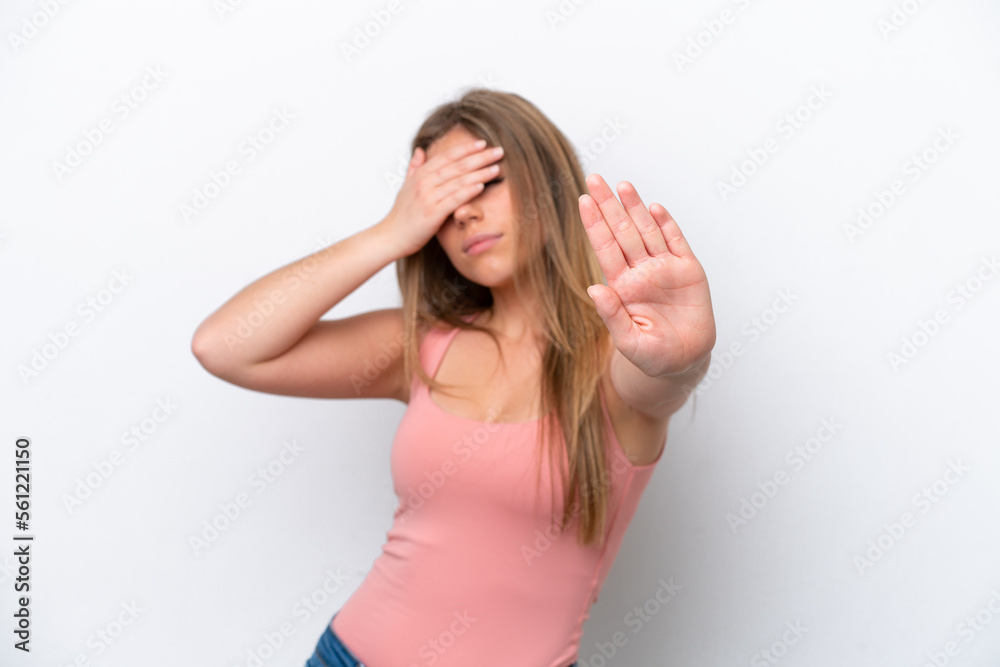 Young caucasian woman isolated on white bakcground making stop gesture and covering face Young caucasian woman isolated on white bakcground making stop gesture and covering face