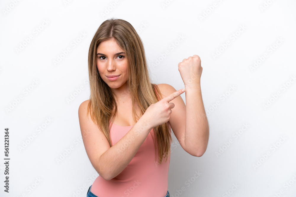 Fototapeta premium Young caucasian woman isolated on white bakcground making the gesture of being late