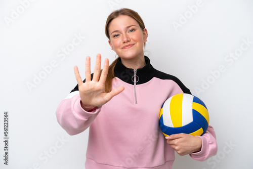 Young caucasian woman playing volleyball isolated on white background counting five with fingers