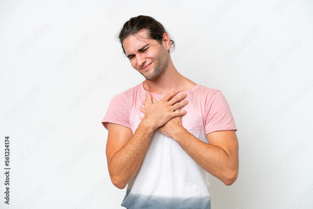 Caucasian handsome man isolated on white background having a pain in the heart