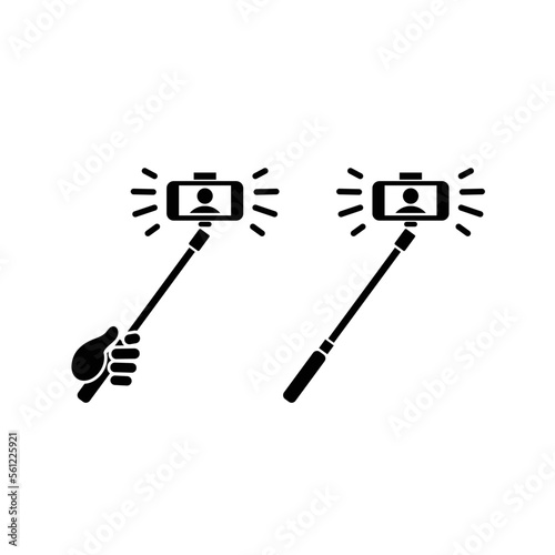 Hand holding selfie stick taking picture icon vector symbol.