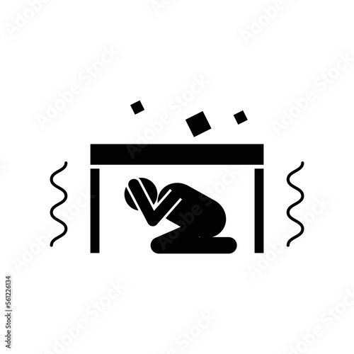 Man hiding under table during earthquake icon vector symbol.