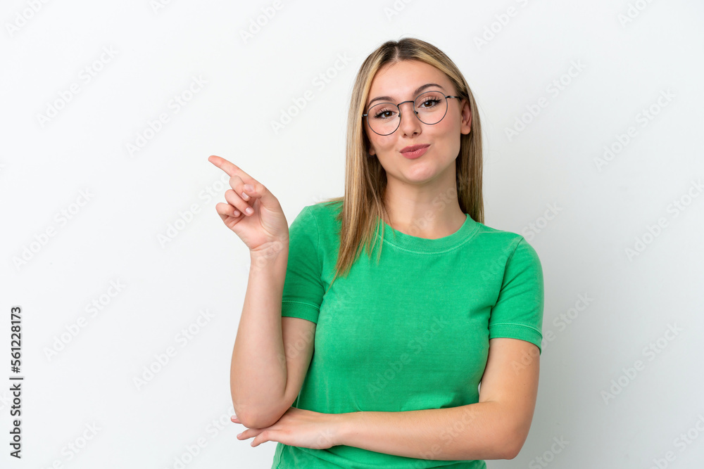 Young caucasian woman isolated on white background happy and pointing up Young caucasian woman isolated on white background happy and pointing up