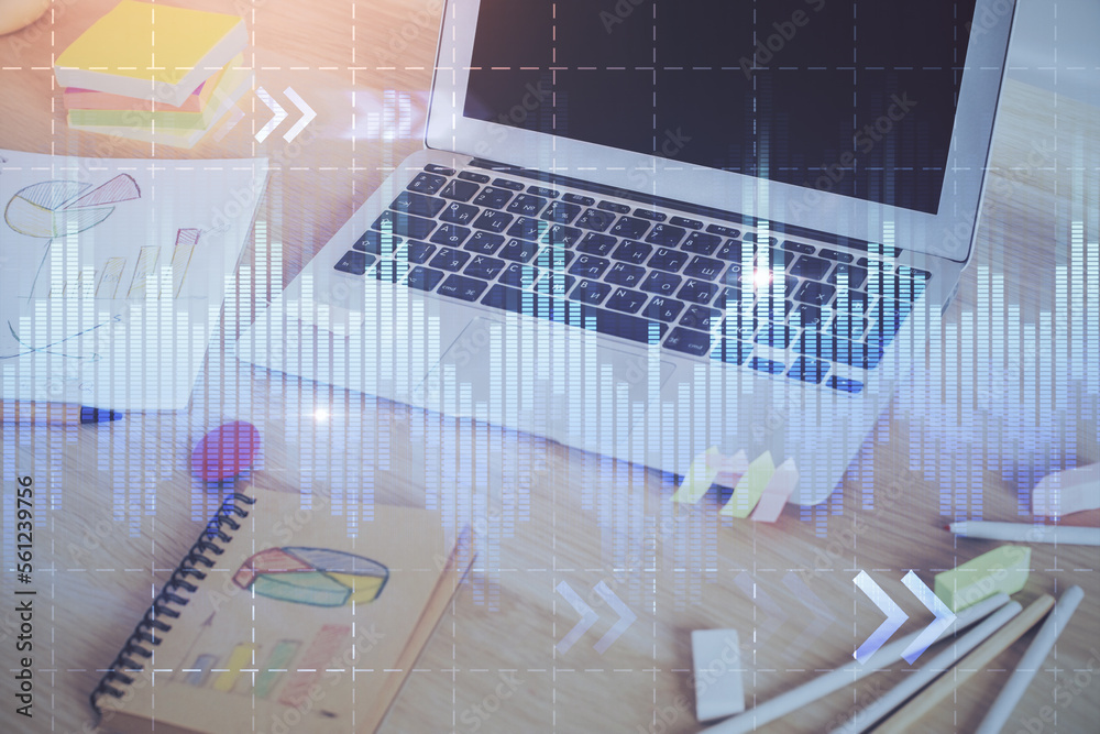 Forex market graph hologram and personal computer on background. Multi exposure. Concept of investment. Forex market graph hologram and personal computer on background. Multi exposure. Concept of investment.