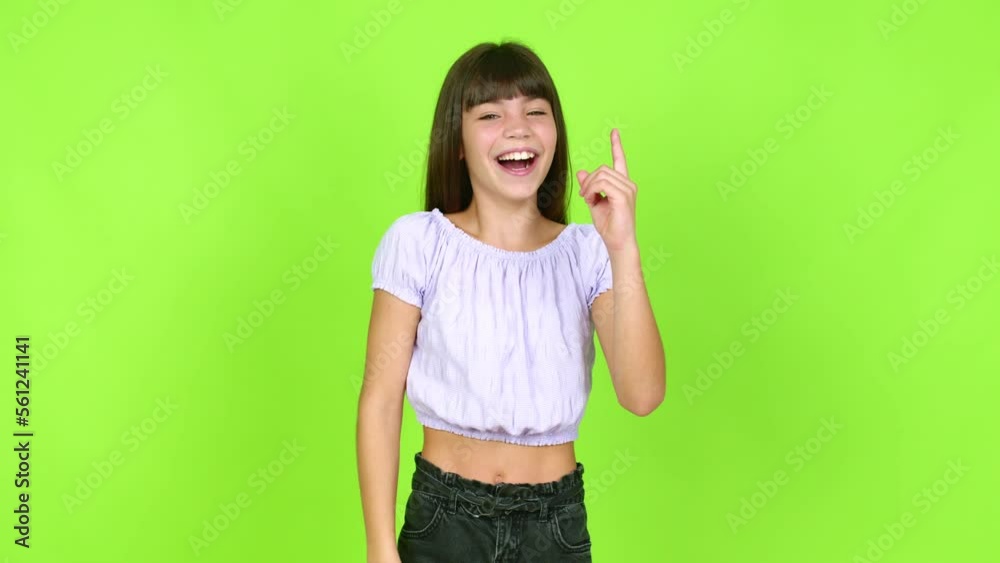 Little girl intending to realizes the solution while lifting a finger up over isolated background Little girl intending to realizes the solution while lifting a finger up over isolated background