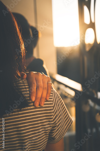 Obraz na plátně woman put hand on friend shoulder give encouragement in ,love, support concept