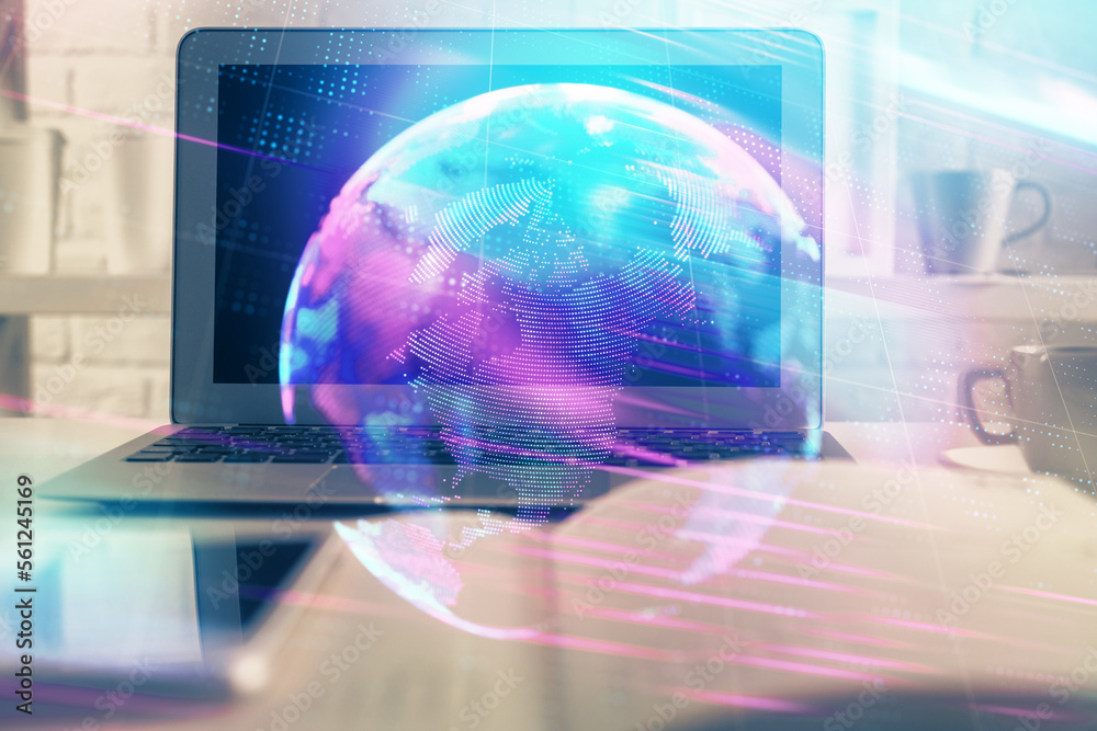 Computer on desktop in office with technology theme hologram. Multi exposure. Tech concept. Computer on desktop in office with technology theme hologram. Multi exposure. Tech concept.