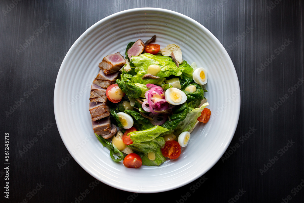 Tuna salad with tomato, egg, herbs and sauce Tuna salad with tomato, egg, herbs and sauce