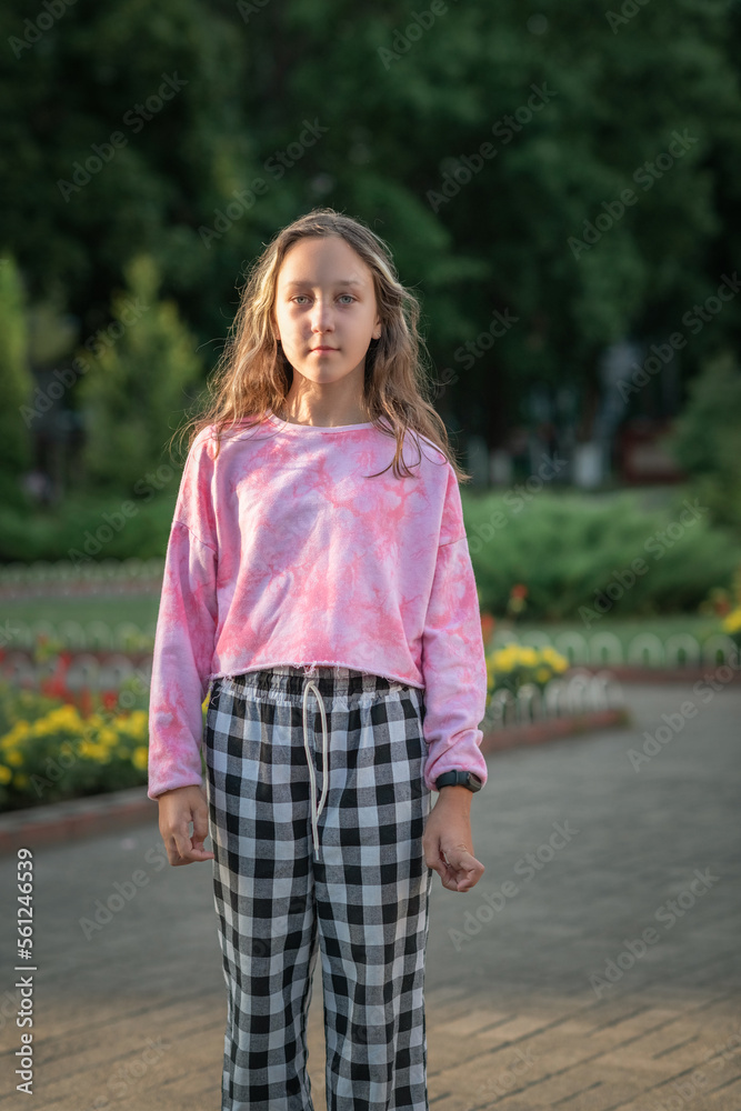 Portrait of a young beautiful girl in summer in an urban environment. Portrait of a young beautiful girl in summer in an urban environment.