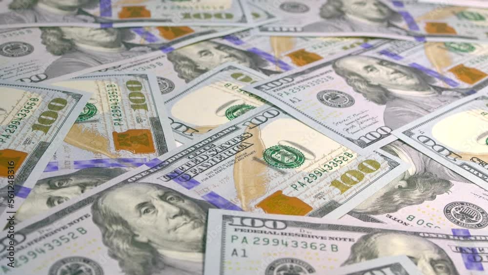 Lots of money. Dollar bill close-up. Income, capital and wealth. Enrichment with 100 US dollar bills. Bank savings. Lots of money. Dollar bill close-up. Income, capital and wealth. Enrichment with 100 US dollar bills. Bank savings.