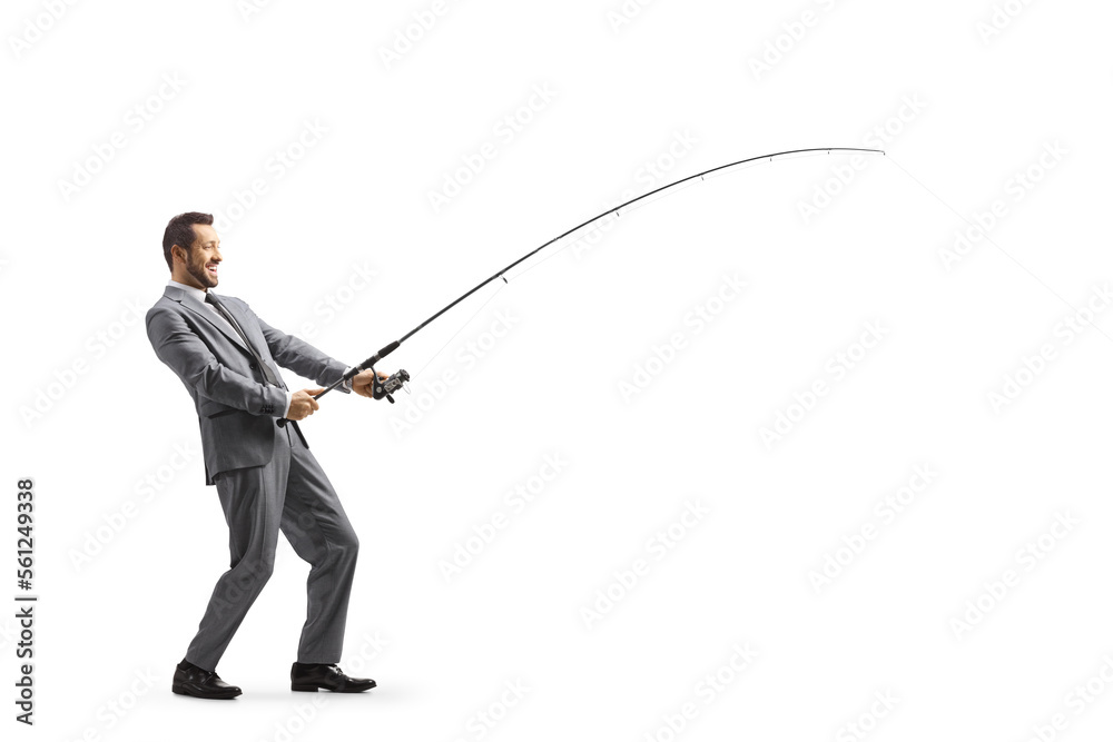 Obraz premium Full length profile shot of a businessman fishing