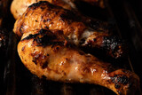 Cooked chicken drumsticks on barbecue
