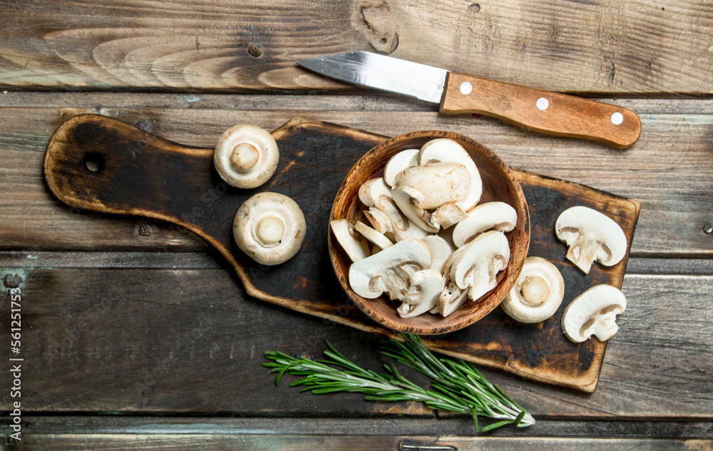 Pieces of fragrant mushrooms in bowl on cutting Board Pieces of fragrant mushrooms in bowl on cutting Board
