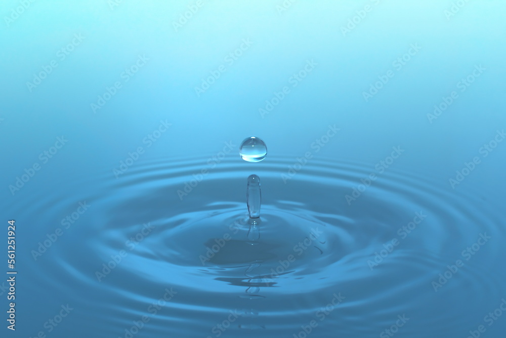 Waves of water are caused by falling droplets. close-up view. Waves of water are caused by falling droplets. close-up view.