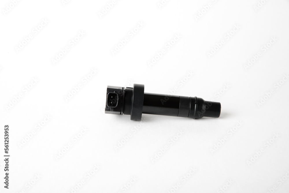 Isolated on a white background the ignition coil of an internal combustion engine.