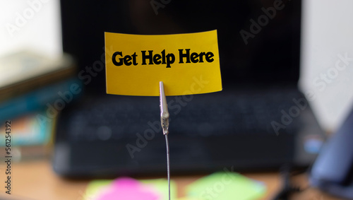 Concept of New Beautiful Get help here symbol, Get help here symbol written on a card at the office.Business and get help here concept.