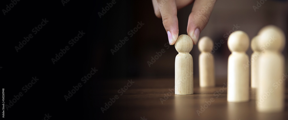 Hand choose wooden doll stand out first the group concept of relationship or HR human resources officer or business team and personnel management job performance. Hand choose wooden doll stand out first the group concept of relationship or HR human resources officer or business team and personnel management job performance.