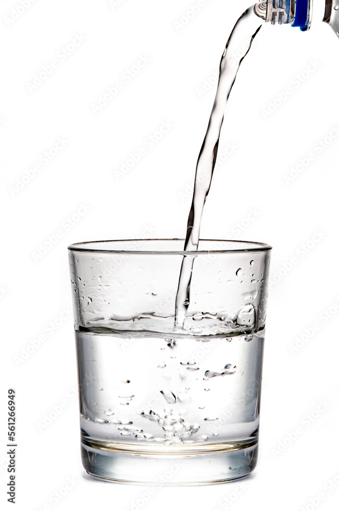 pouring water in glass, white background. clear sparkling water pouring water in glass, white background. clear sparkling water