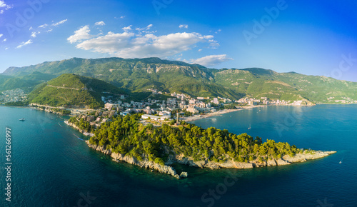 Panorama of bird's eye view of towns of Budva and Becici with hotels and beaches near Adriatic Sea against the backdrop of the Montenegrin Mountains