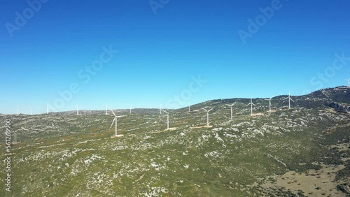 A panoramic view of wind turbines in Europe, central Greece, towards Thisbe, in summer, on a sunny day. photo