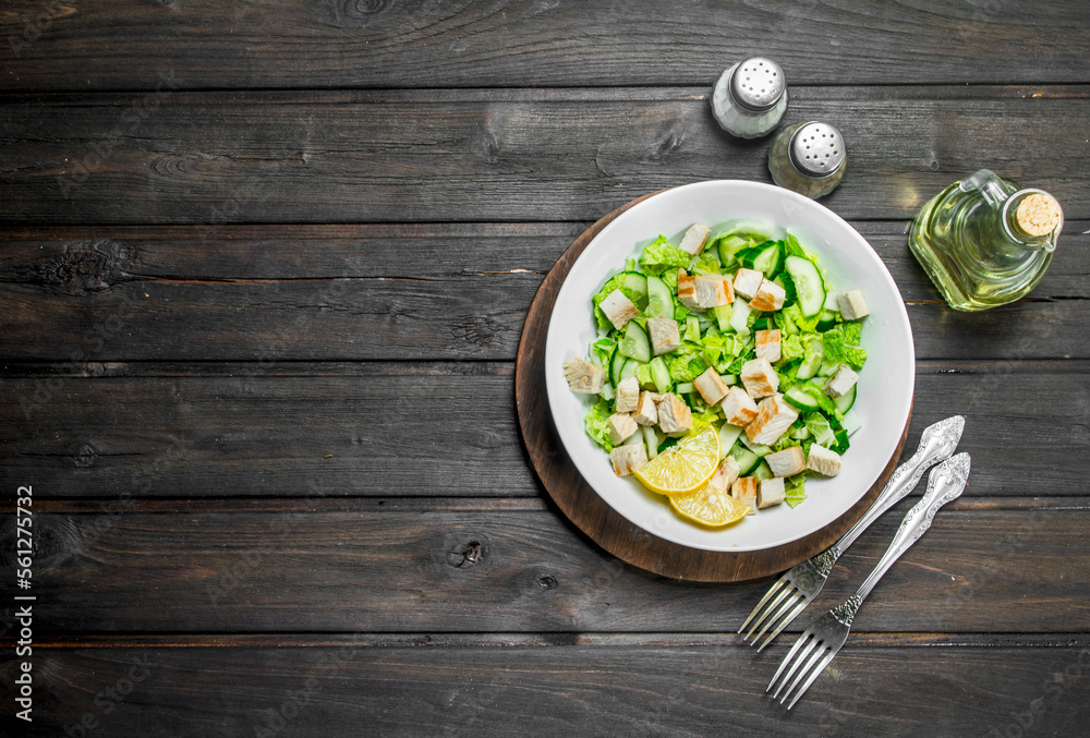 Healthy salad. Salad with cucumbers, chicken and Chinese cabbage poured lemon juice . Healthy salad. Salad with cucumbers, chicken and Chinese cabbage poured lemon juice .