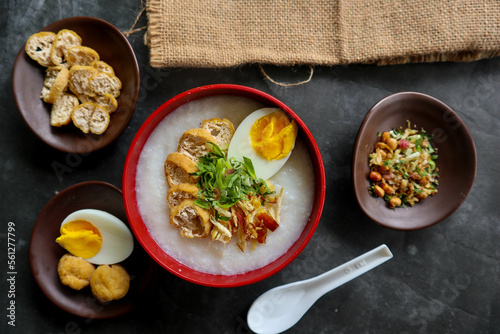 congee porridge with chicken slice, tofu, egg. congee porridge from hong kong. chinese food