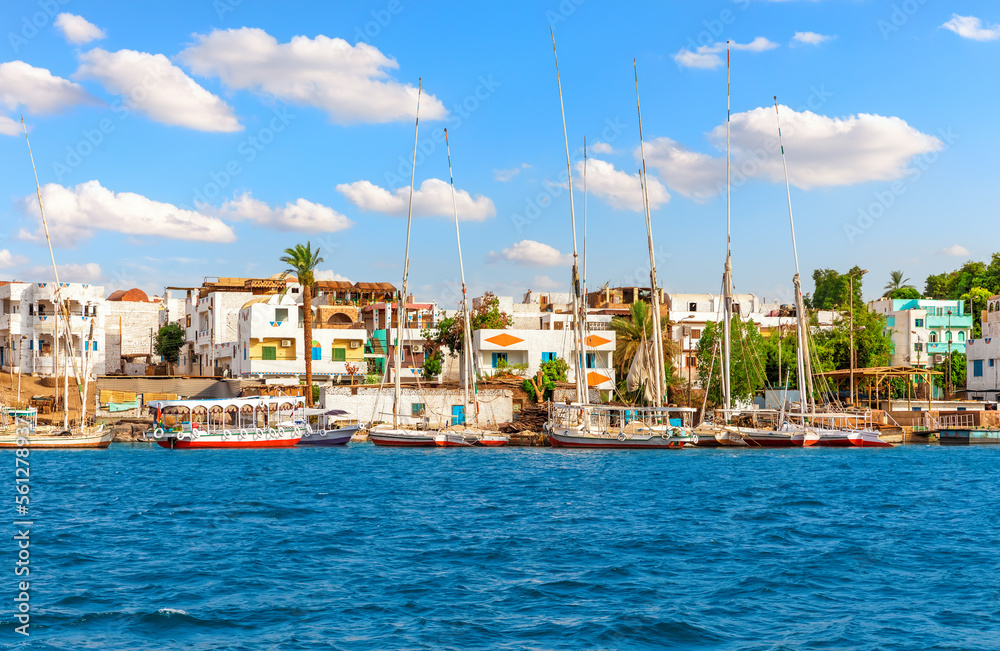 Traditional buildings of Aswan in the Nile and sailboats, Egypt
