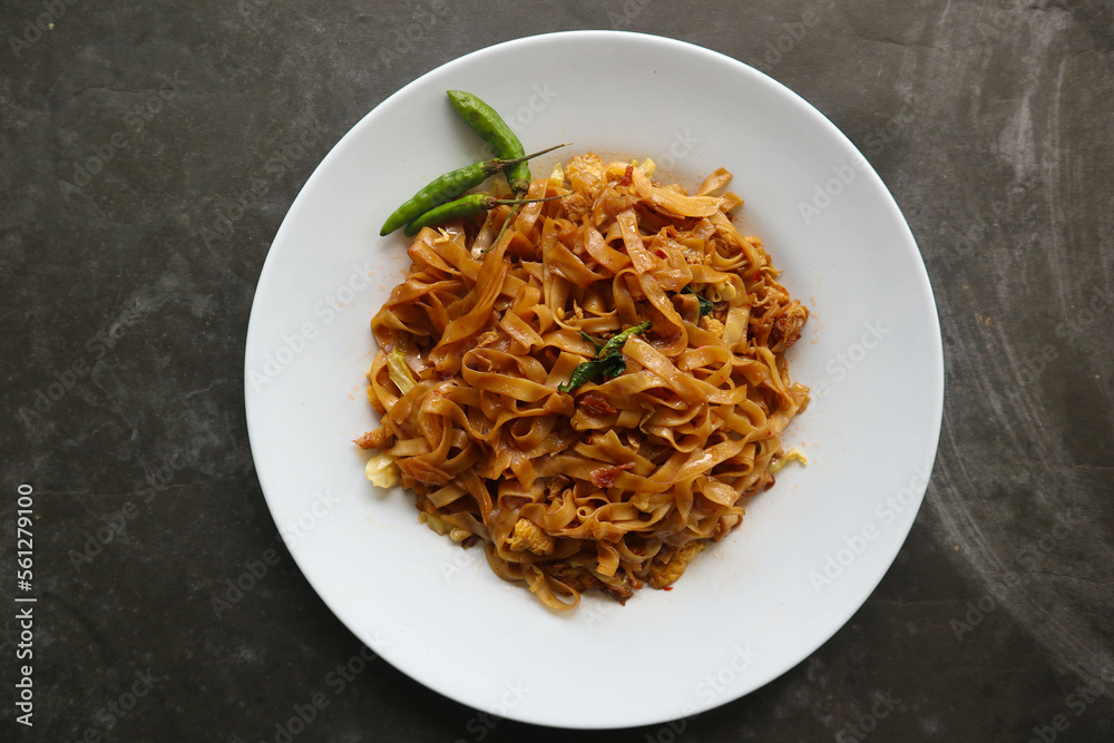 Kwetiau goreng is Chinese Indonesian stir fried flat rice noodle dish made from kwetiau, stir fried in cooking oil with garlic, onion ,beef, chicken, fried prawn, crab and other vegetable