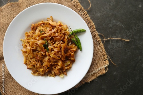 Kwetiau goreng is Chinese Indonesian stir fried flat rice noodle dish made from kwetiau, stir fried in cooking oil with garlic, onion ,beef, chicken, fried prawn, crab and other vegetable