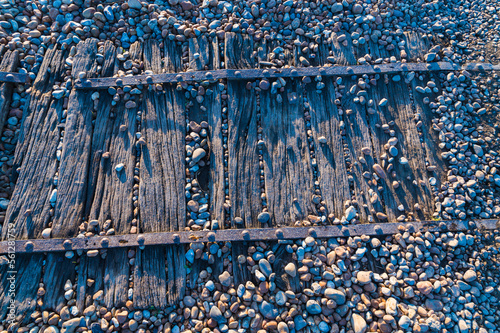 Close-up of a wooden walkway on the shingle beach at Rye Harbour, UK