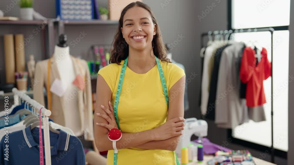 Young african american woman tailor smiling confident standing with arms crossed gesture at atelier