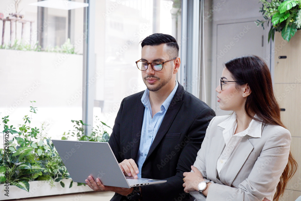 Manager teaching female employees using laptop to work business idea. Manager teaching female employees using laptop to work business idea.