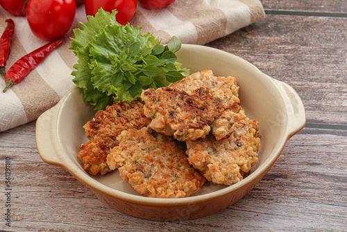 Fried salmonn cutlet in the bowl photo