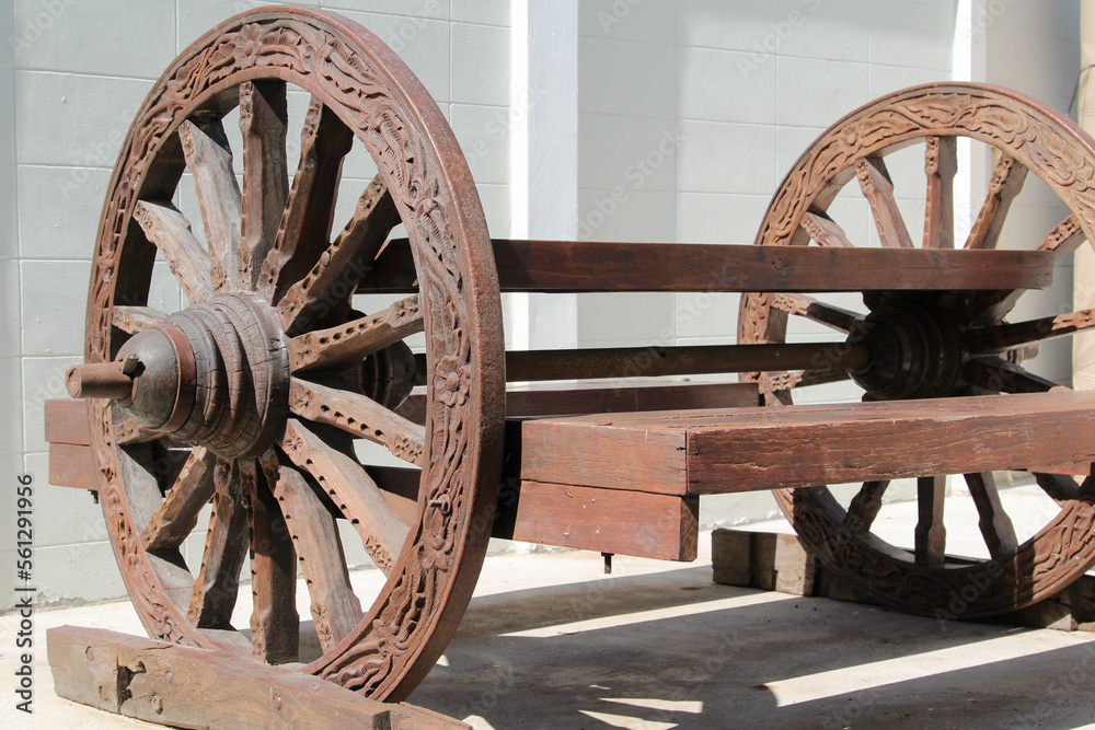 Traditional Thai style wooden outdoor furniture made using old cart wheels