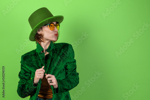 St. Patrick's Day leprechaun model woman. Beautiful smiling woman wearing green hat photo