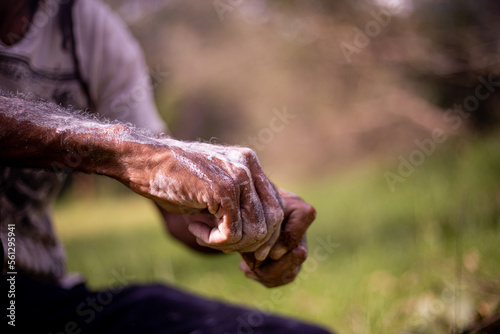 Hands with white paint on them photo