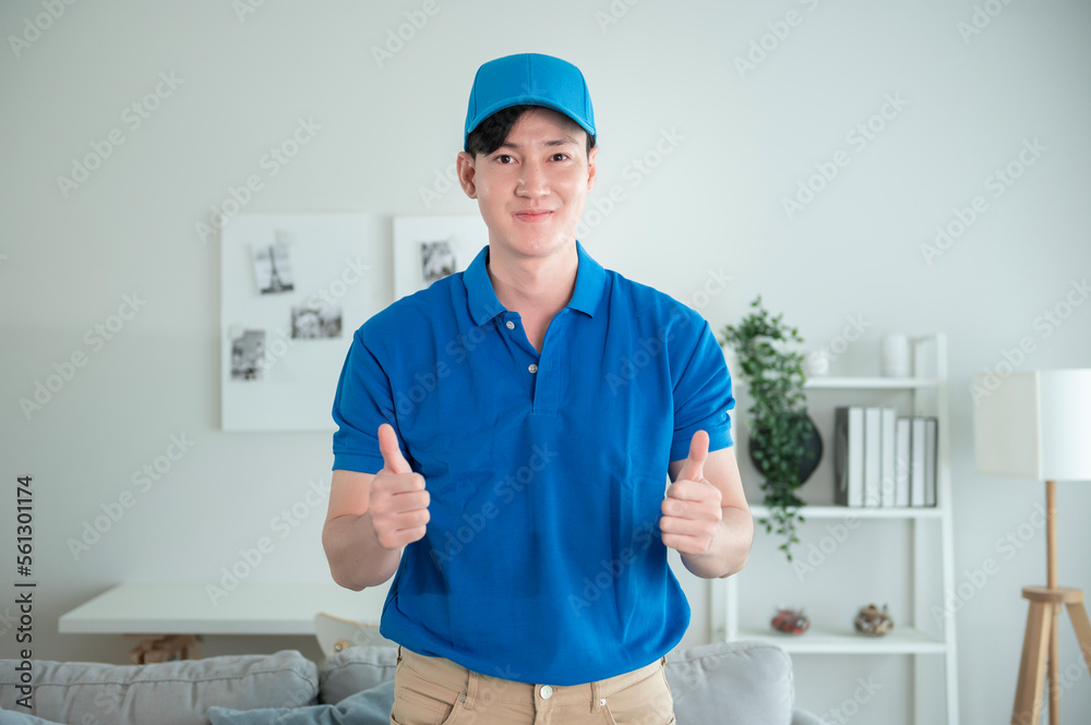 An Asian young Technician service man wearing blue uniform checking electrical appliances in home An Asian young Technician service man wearing blue uniform checking electrical appliances in home