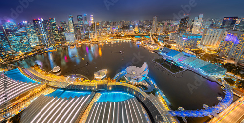 Canvas Print Panoramic Aerial view Singapore city skyline at night, Singapore , hotel and financial business building around Marina bay at night with building light