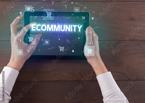 Close-up of a hand holding tablet with shopping inscription photo