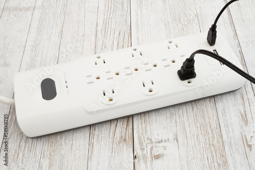 Foto Surge protector with USB protection on weathered wood