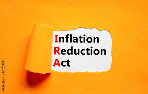 IRA inflation reduction act symbol. Concept words IRA inflation reduction act on white paper on a beautiful orange background. Business IRA inflation reduction act concept. Copy space.