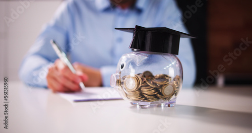 Bild auf Leinwand Piggy Bank With School Education Budget