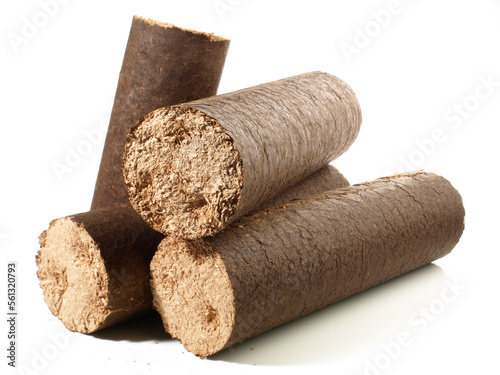 Foto Round Hardwood Sawdust Briquettes - Compressed Biomass Wood Fire Logs isolated o