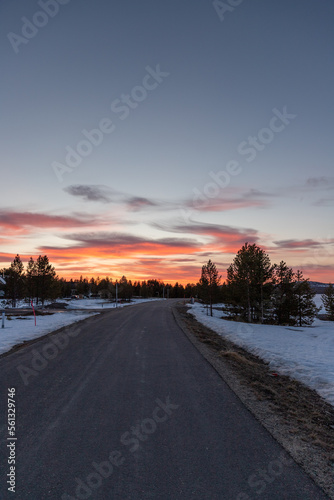 sunset on the road with snow