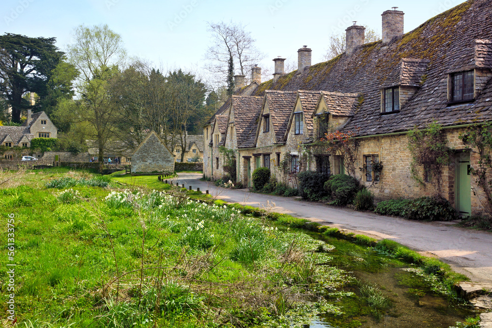 Idyllic old stone houses of Arlington Row in the Cotswolds village of Bibury, England