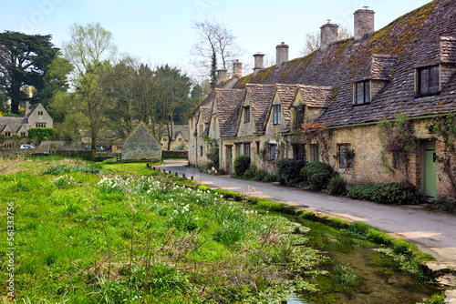Idyllic old stone houses of Arlington Row in the Cotswolds village of Bibury, England