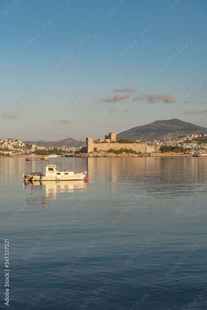Beautiful morning light on Bodrum harbor with a medieval fortress and mountains in the background, Turkish south west Aegean Coast, Turkey