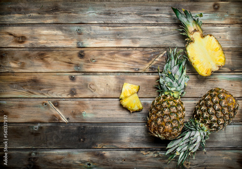 Cut and whole fresh pineapples.